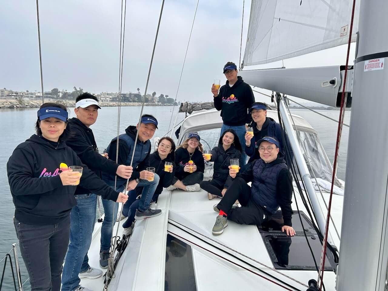 Group of people enjoying their brunch and mimosas onboard their sailboat rental in Marina del Rey