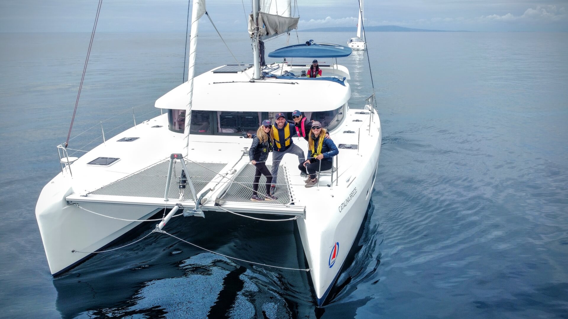 Header image showing members of Naos Yachts on a catamaran trip to Catalina Island