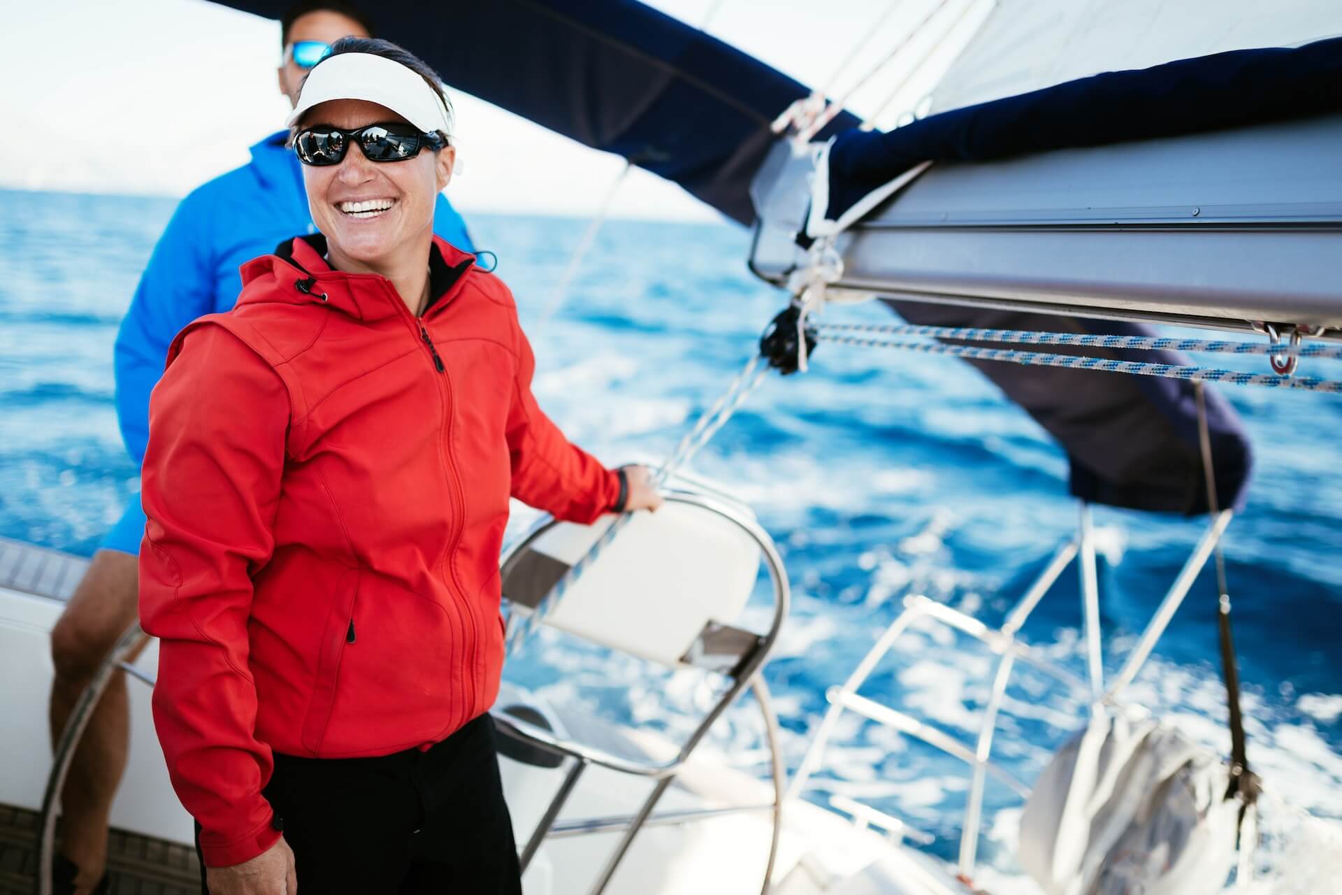 attractive strong woman sailing with her boat one