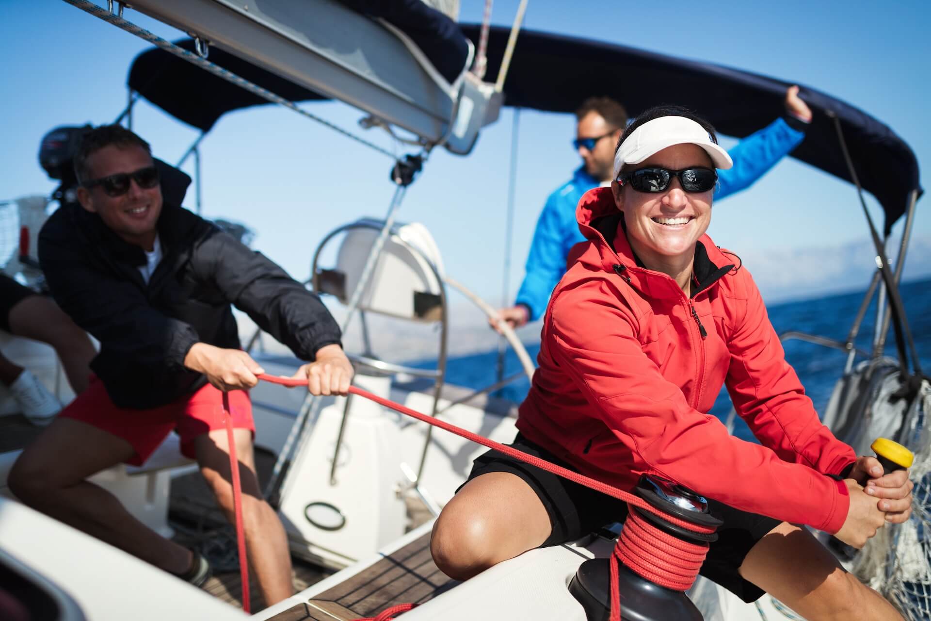 attractive strong woman sailing with her boat two