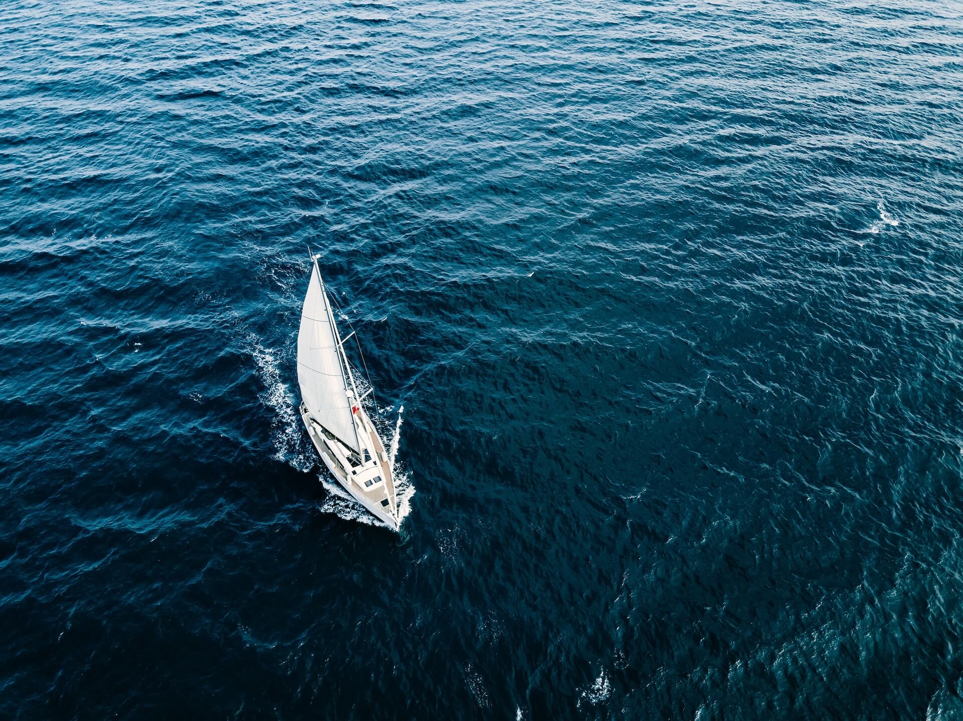 aerial view of sailing ship yachts with white sail