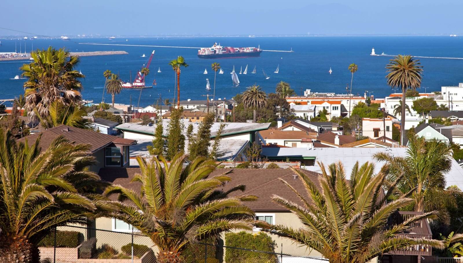 View of the Pacific Ocean in San Pedro, CA, with yachts and sailboats in the water.